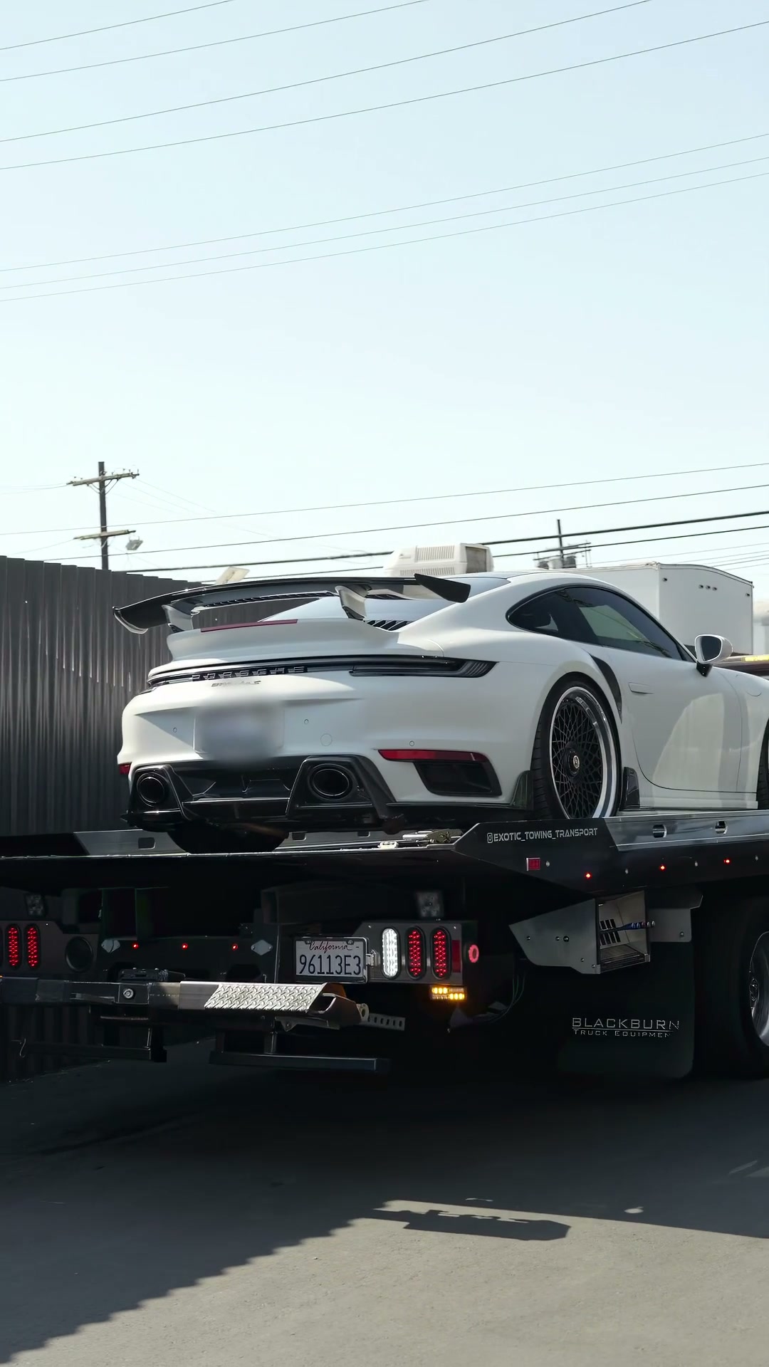 Towing Service — Porsche on flatbed